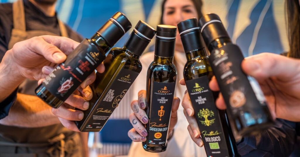 People with Corax olive oil bottles